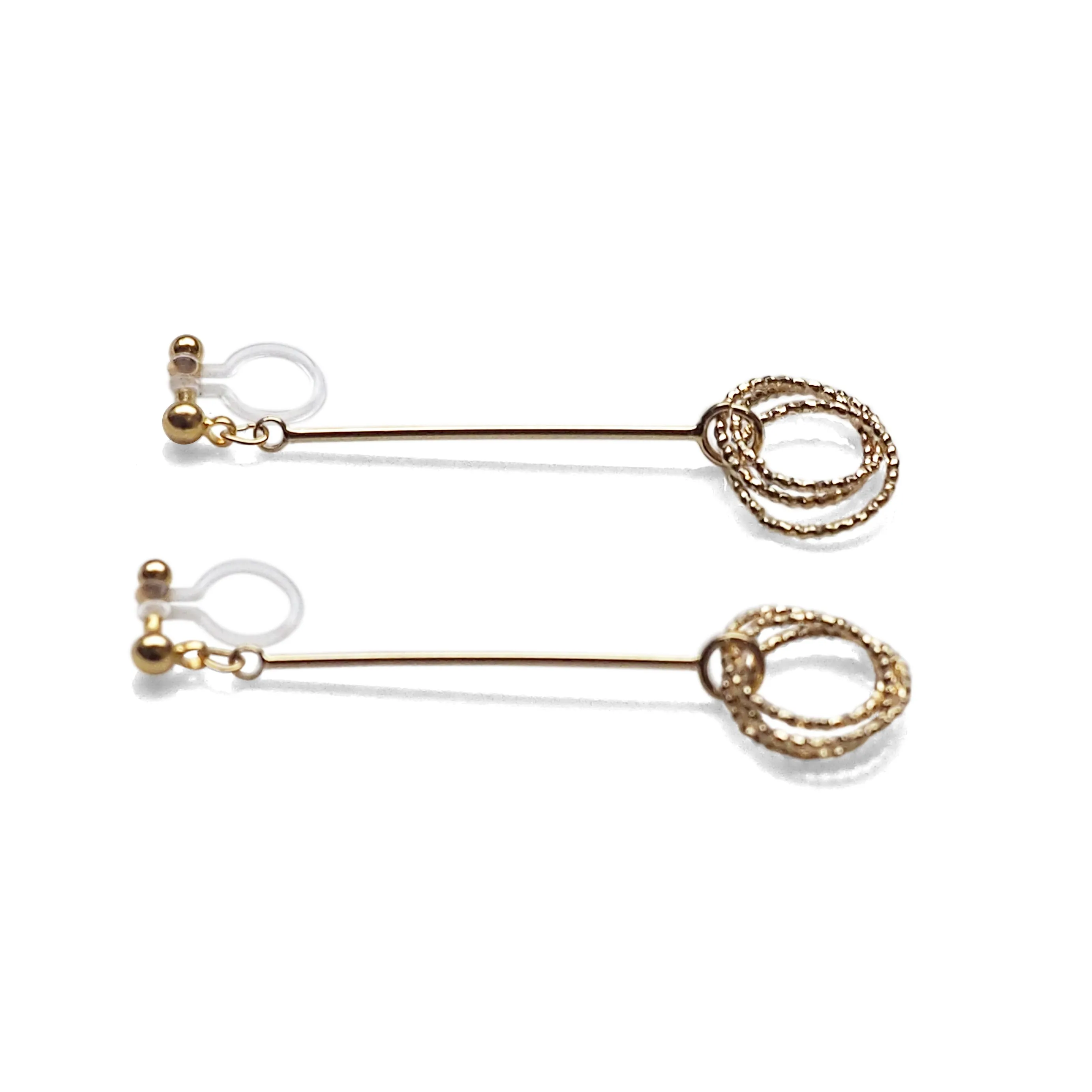 Textured triple hoop clip on earrings ( Gold tone )